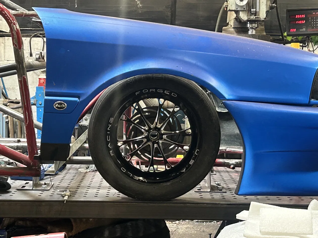 Audi 80 chassis rebuild at PRE workshop with Weld Racing wheel